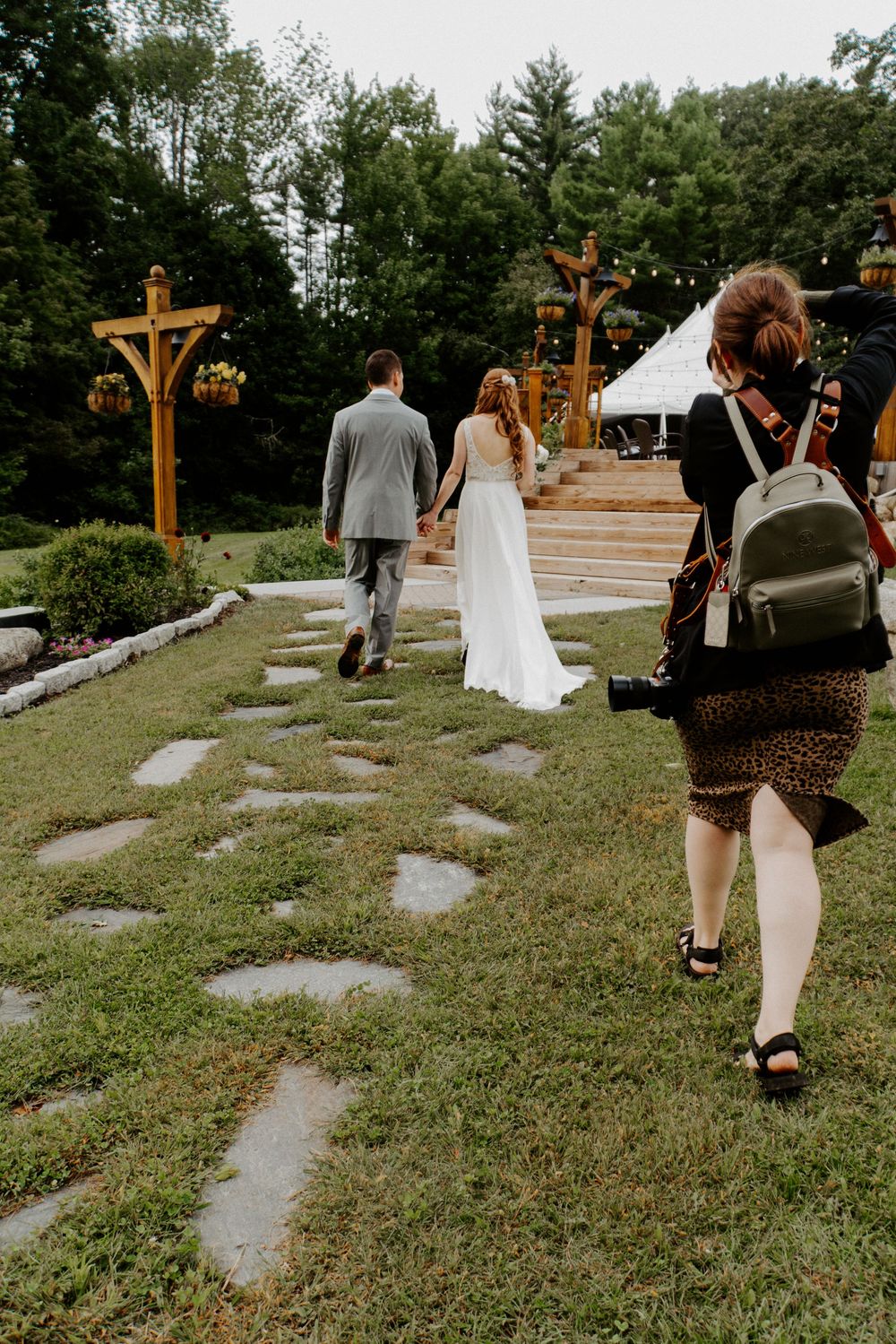 Color photo of Jess working with wedding couple