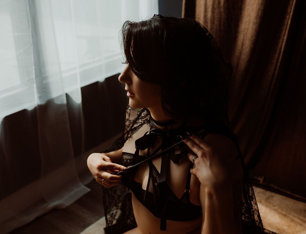 Spooky boudoir photography using dark and moody lighting with Boudoir by KJ.
