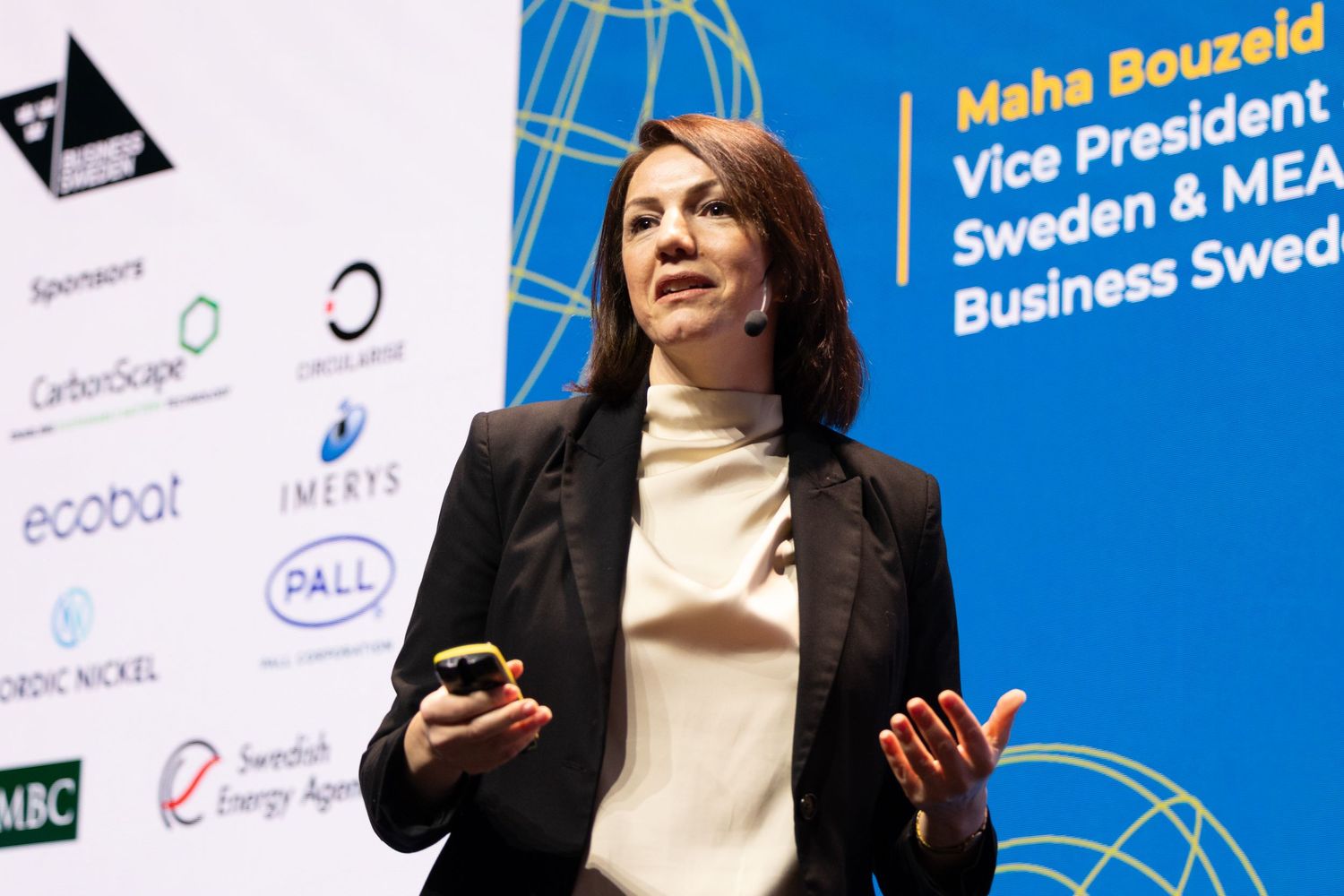 Speaker on stage at a conference