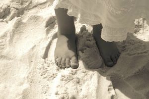 Child's feet in the sand