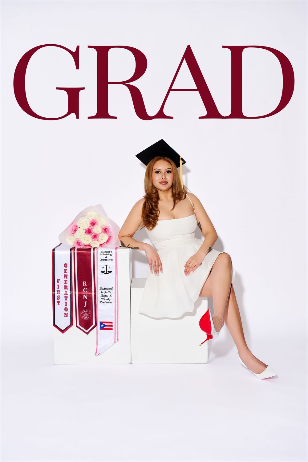 Magazine-style studio graduation portrait with "GRAD" text featuring an RCNJ graduate on a white backdrop, by an NJ portrait photographer