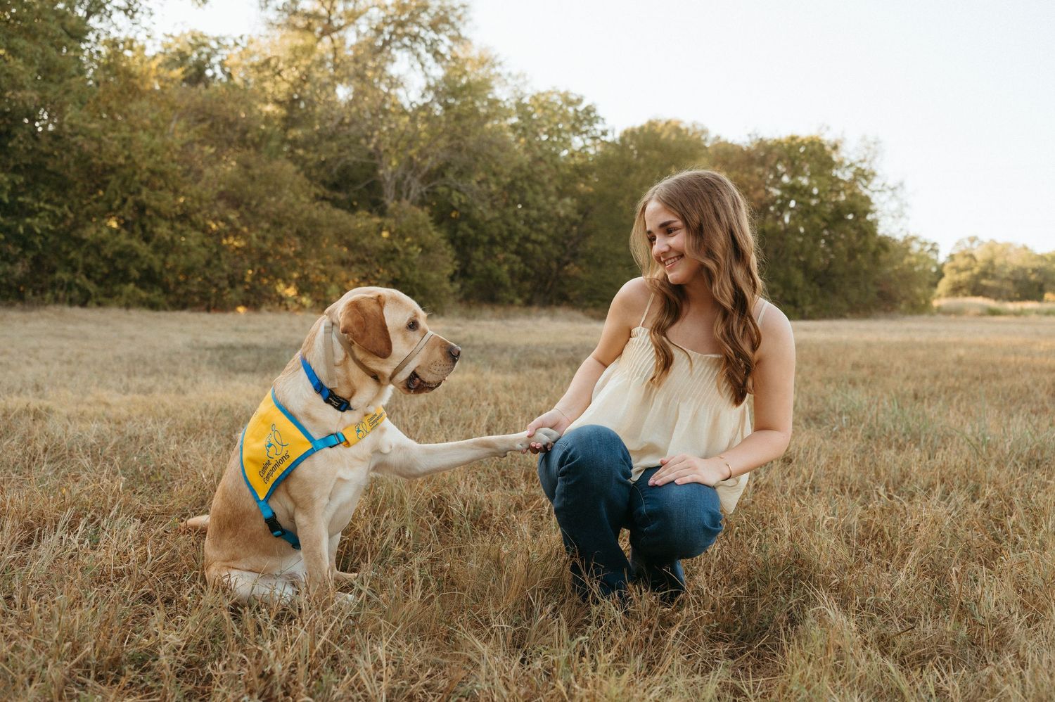 Outdoor senior portrait at Oak Point Nature Preserve with high school senior and service dog in training