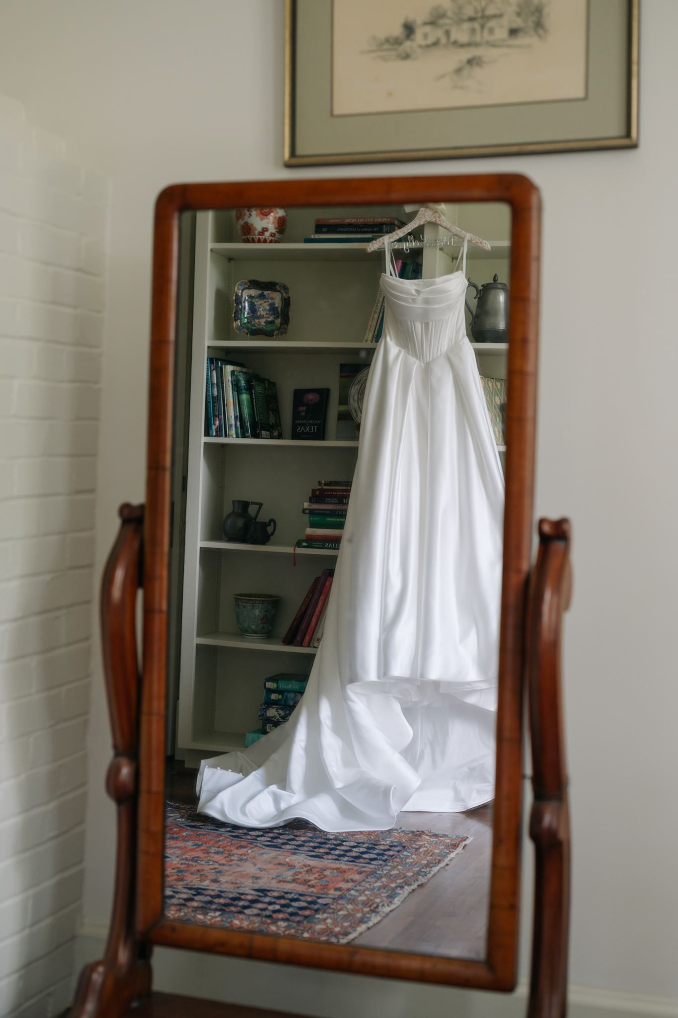 Reflection of Emma's wedding dress in the antique mirror at River Oaks Garden Club.