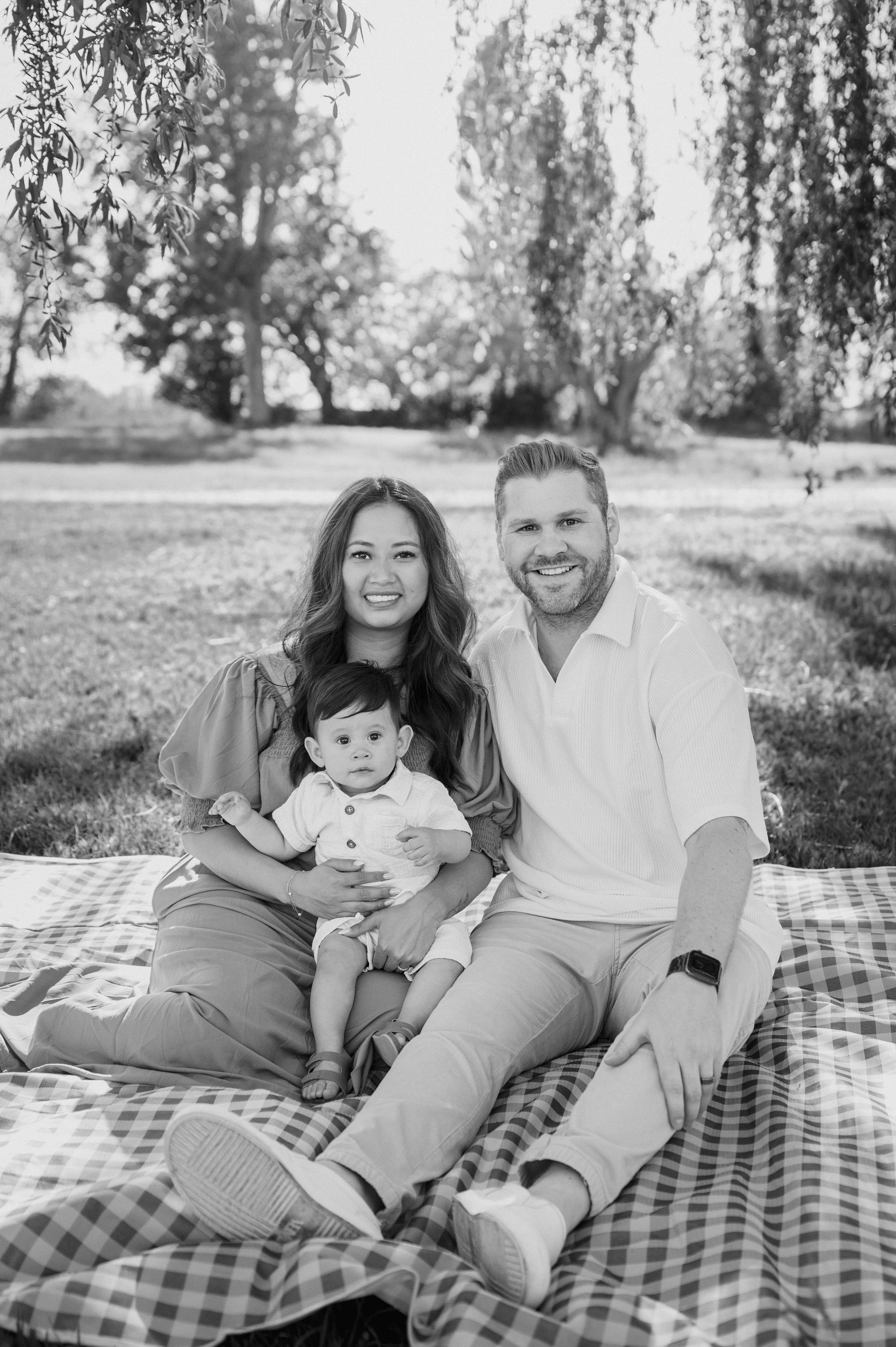 First birthday milestone photos with mom and dad at the park in Tri-Cities, WA