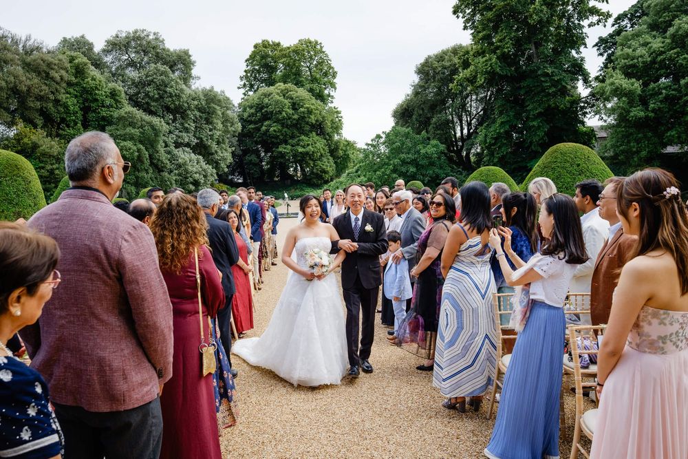 father of the bride walking his daughter down the aisle at Syon park