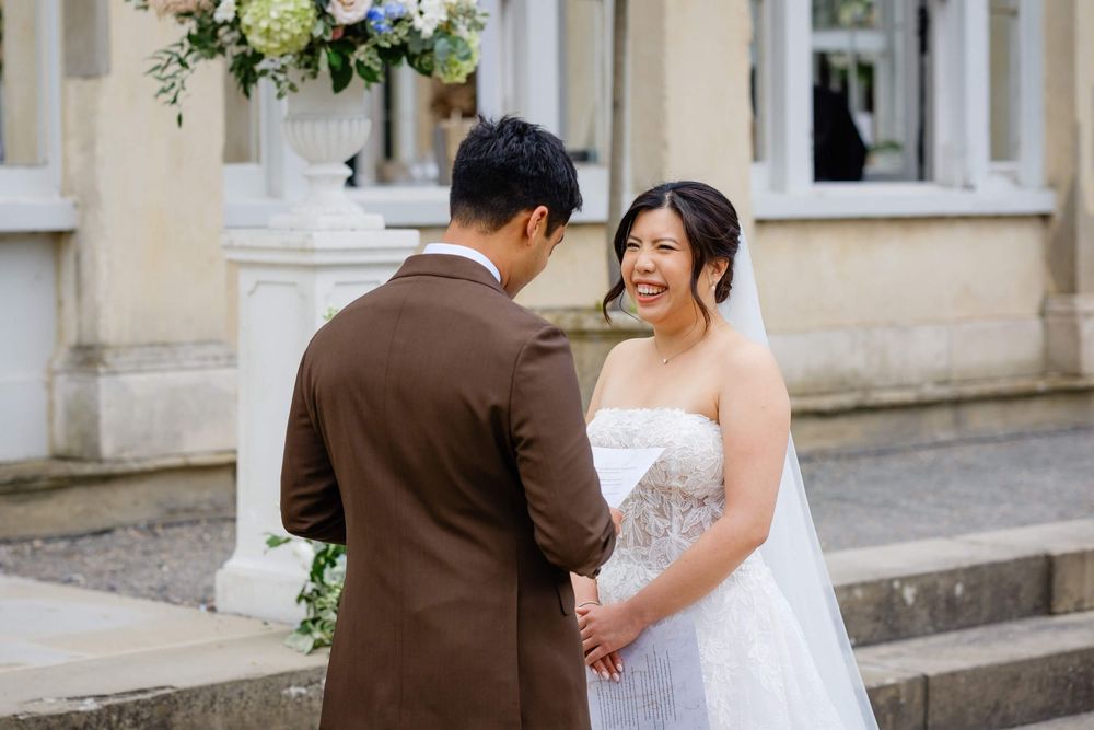 bride and groom exchanging rings