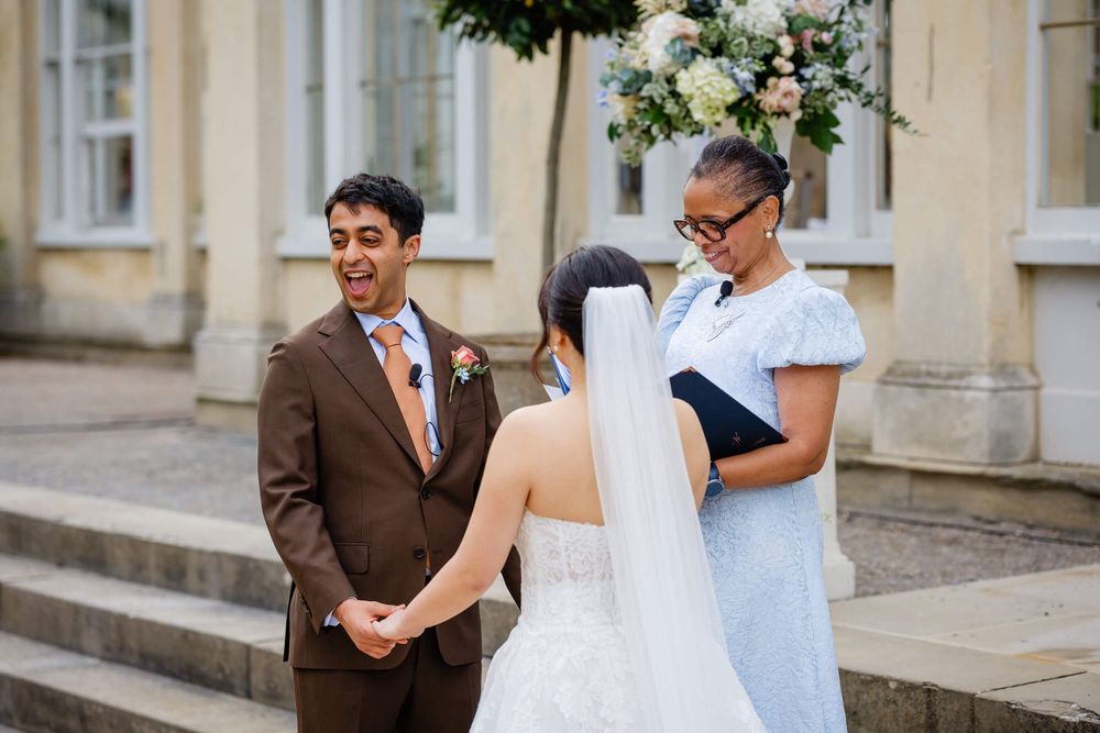 groom laughing and enjoying his wedding ceremony