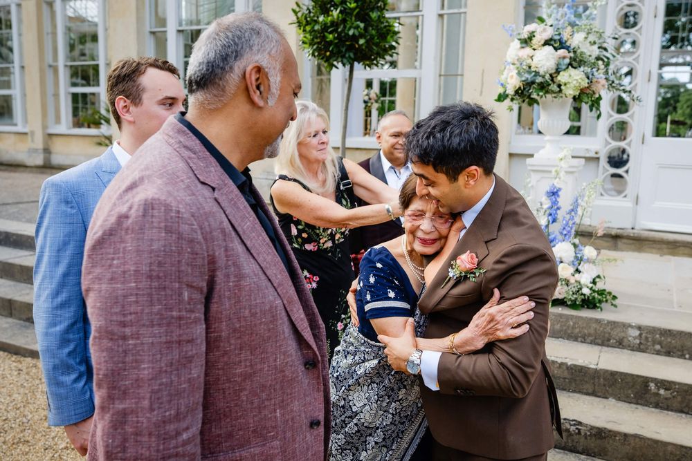 groom hugging his nana at wedding
