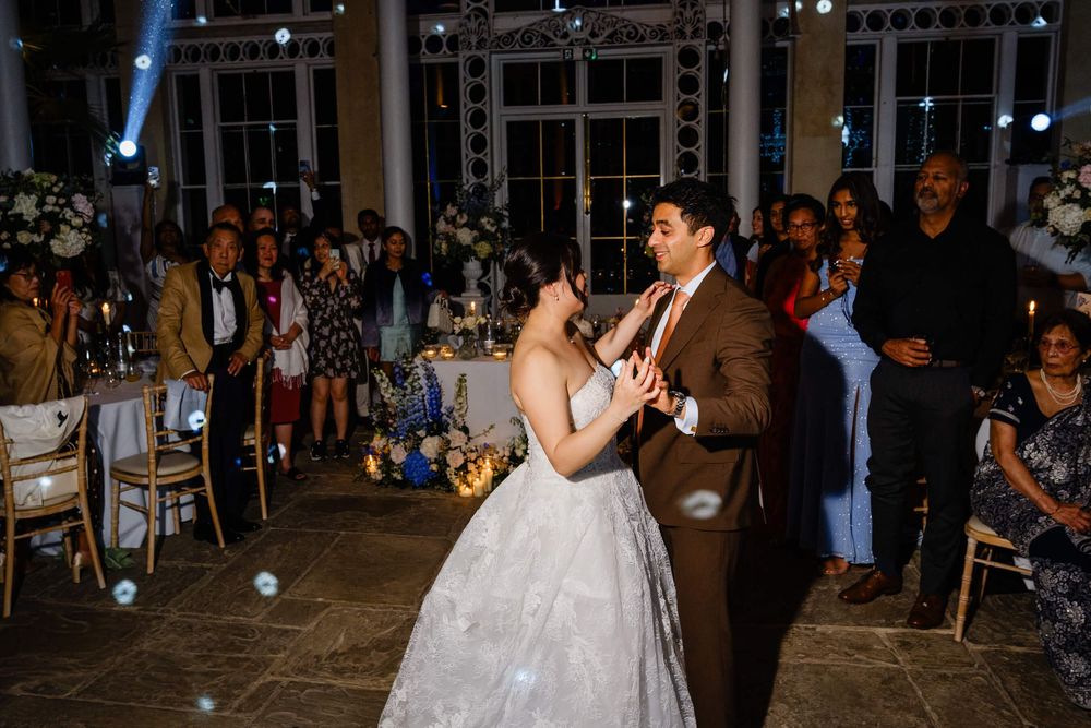 bride and groom having fun on the dance floor