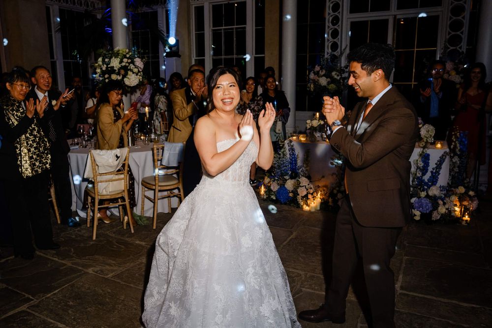 bride and groom celebrate one dance floor