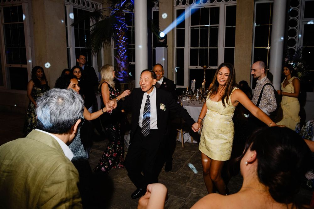 brides father dancing with friends