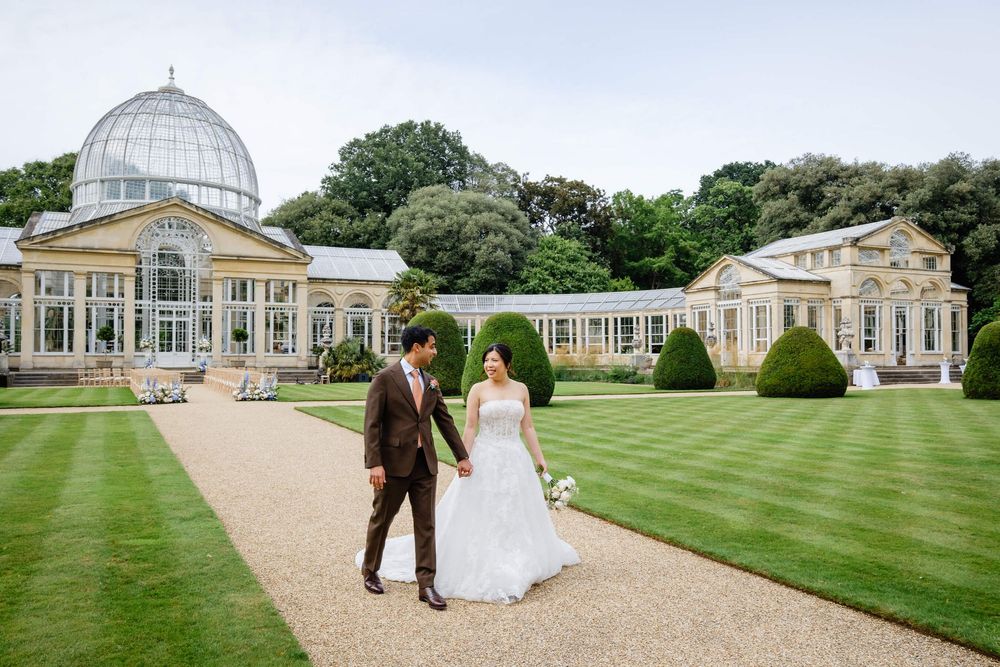 bride and groom walking around Syon park