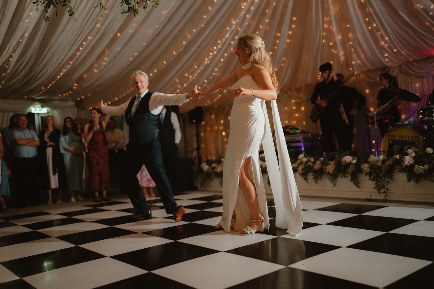 First dance beneath the draped ceiling and lights at a Castle Leslie wedding.