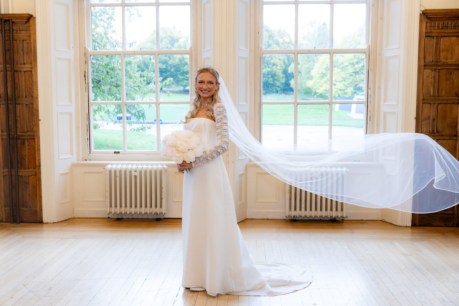 Wedding ceremony in historic church with beautiful stained glass windows and wooden pews.
