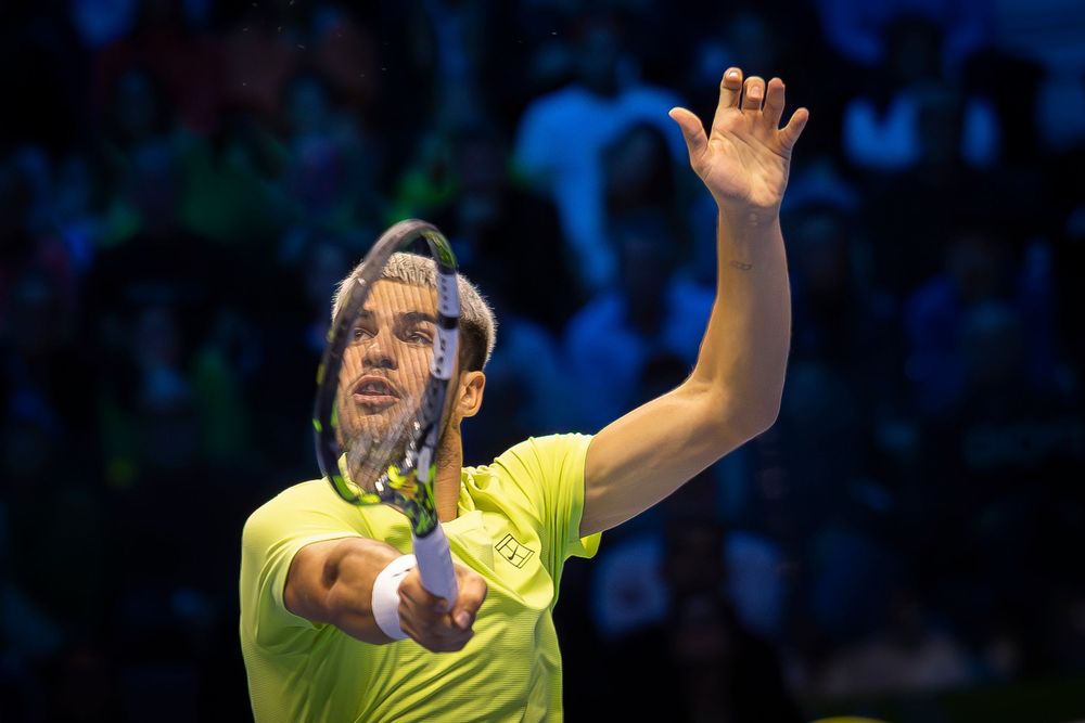 Tennis player Carlos Alcaraz serving a ball during the ATP finals in Torino, Italy