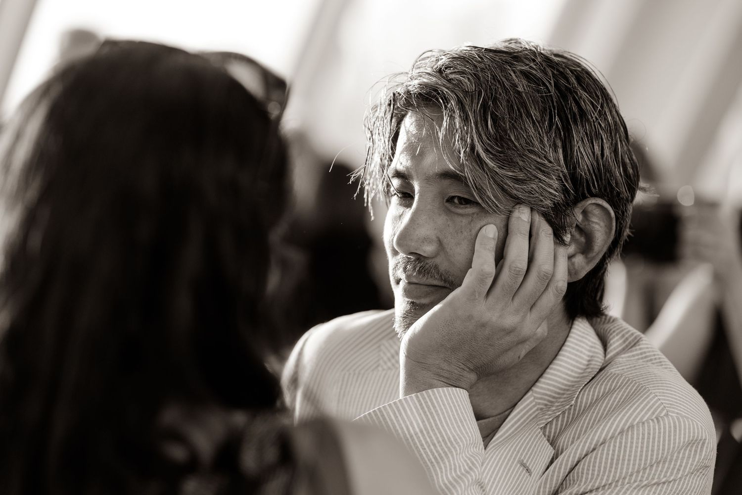 Black and white close-up shots showing intense emotions during a dramatic performance.