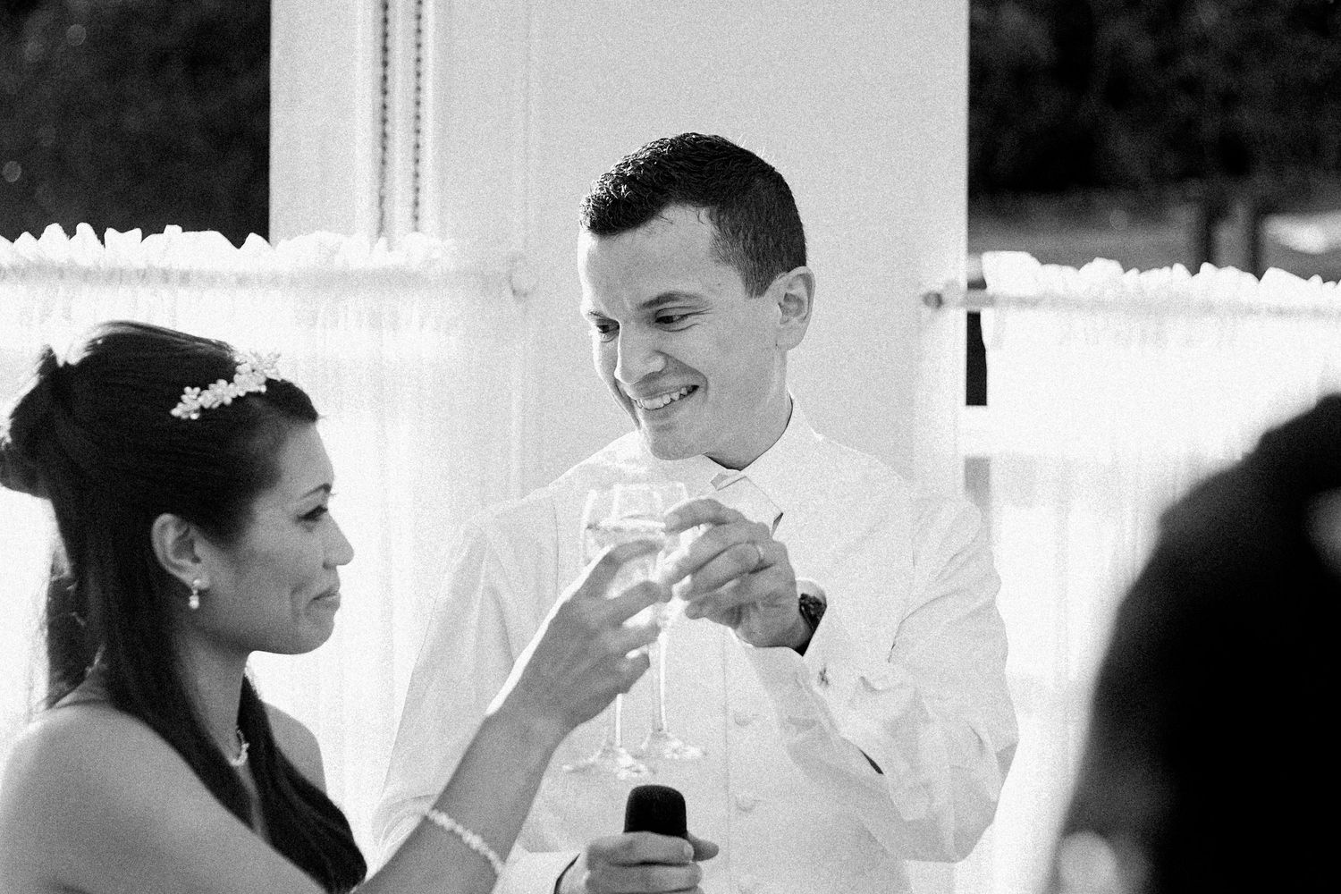 A black and white wedding photo collage showing intimate moments between a couple during their special day.