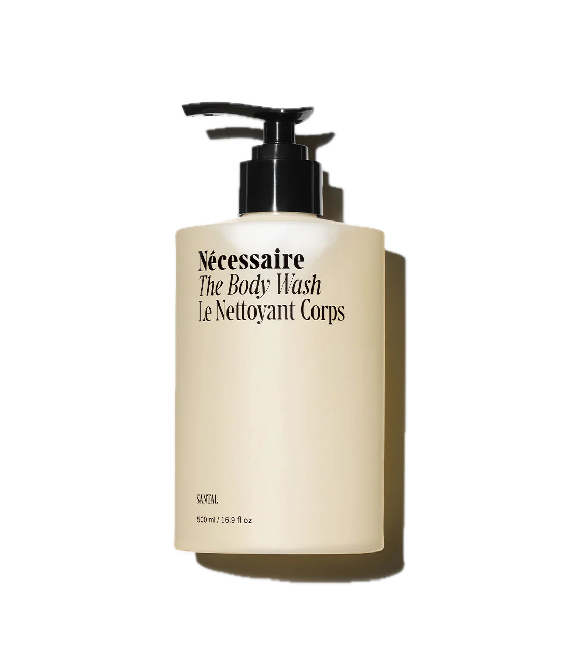A minimalist beige body wash bottle with black pump dispenser labeled 'Necessaire The Body Wash' against white background.