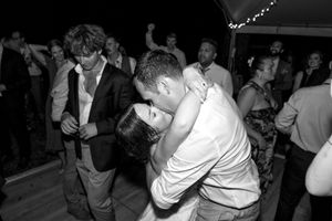 Black and white photo of wedding reception dance party.