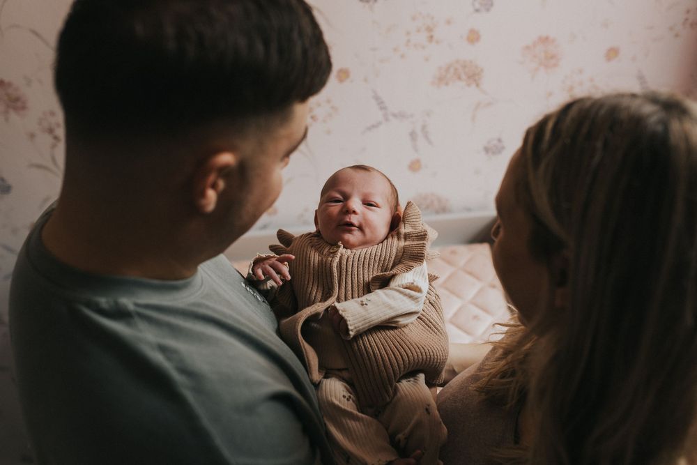 at home newborn photography session parents and newborn