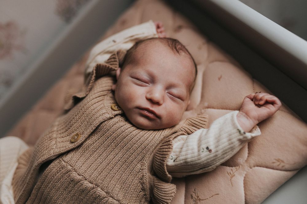 at home newborn photography session newborn baby asleep