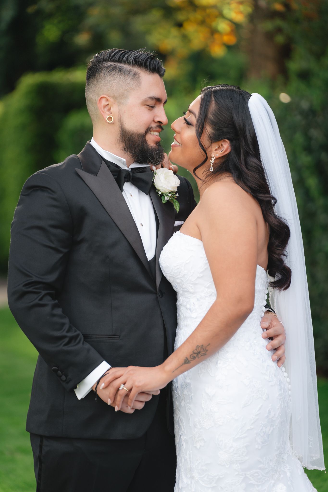 A romantic wedding couple shares intimate moments in a series of outdoor portraits against a green garden background.