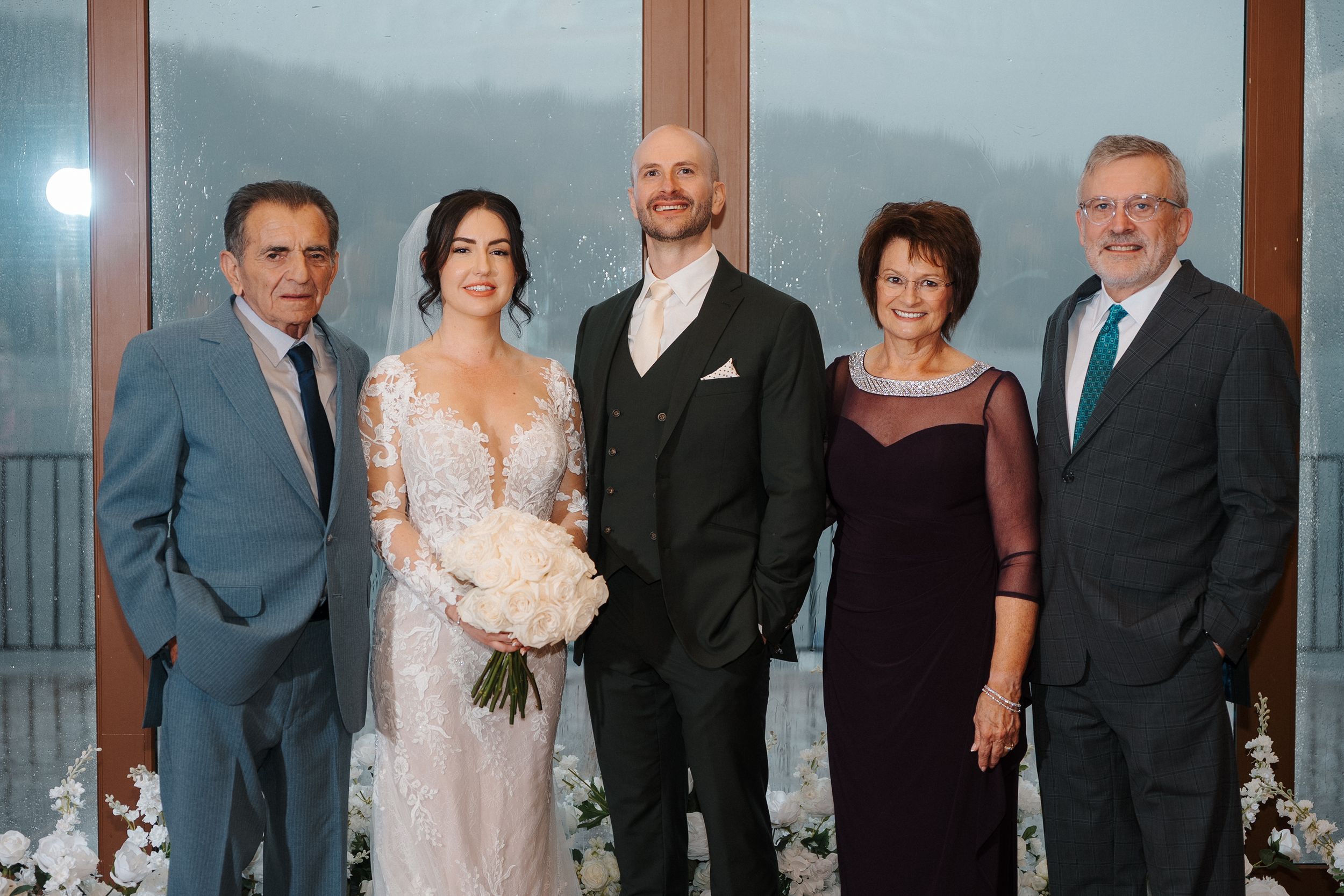 A group of wedding party members pose together in formal attire in a series of connected photos.