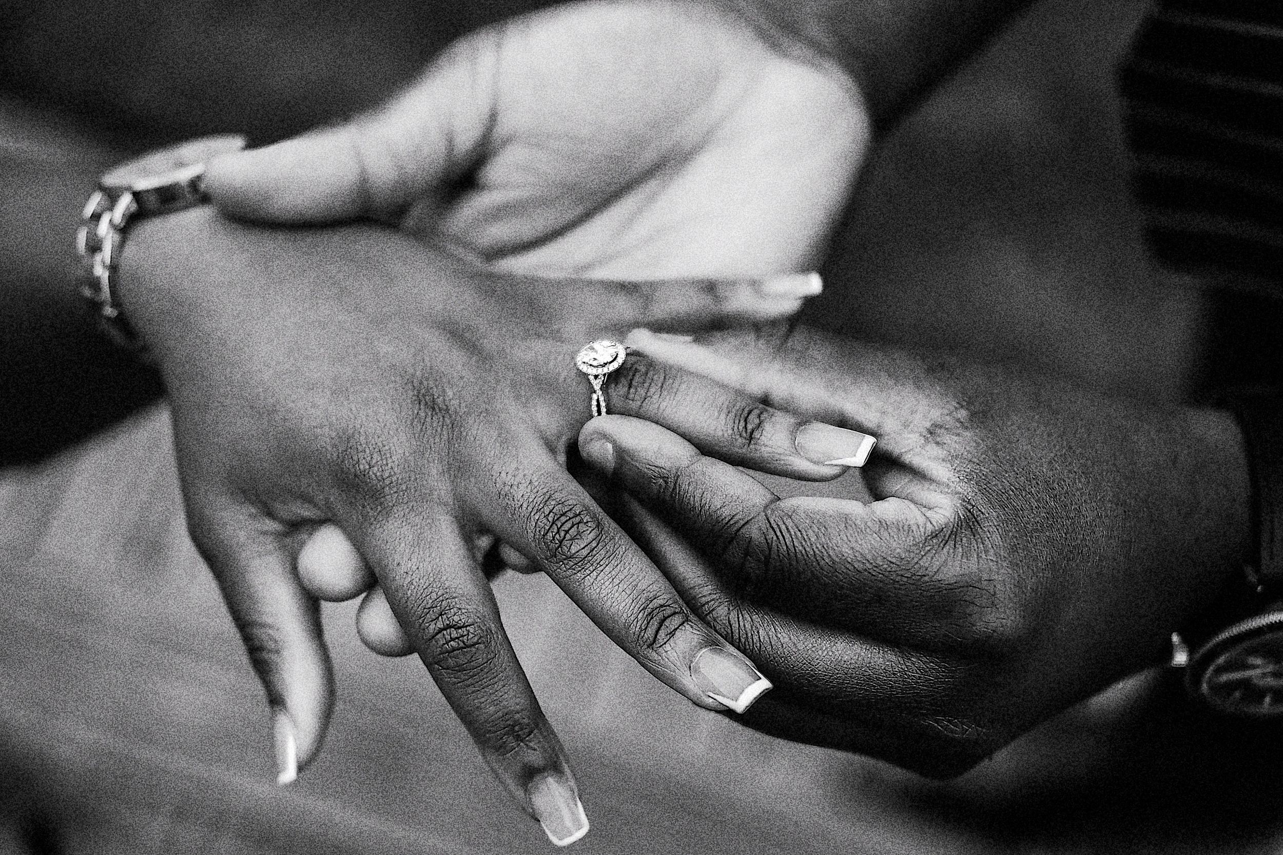 Black and white photos showing hands exchanging rings during a wedding ceremony.