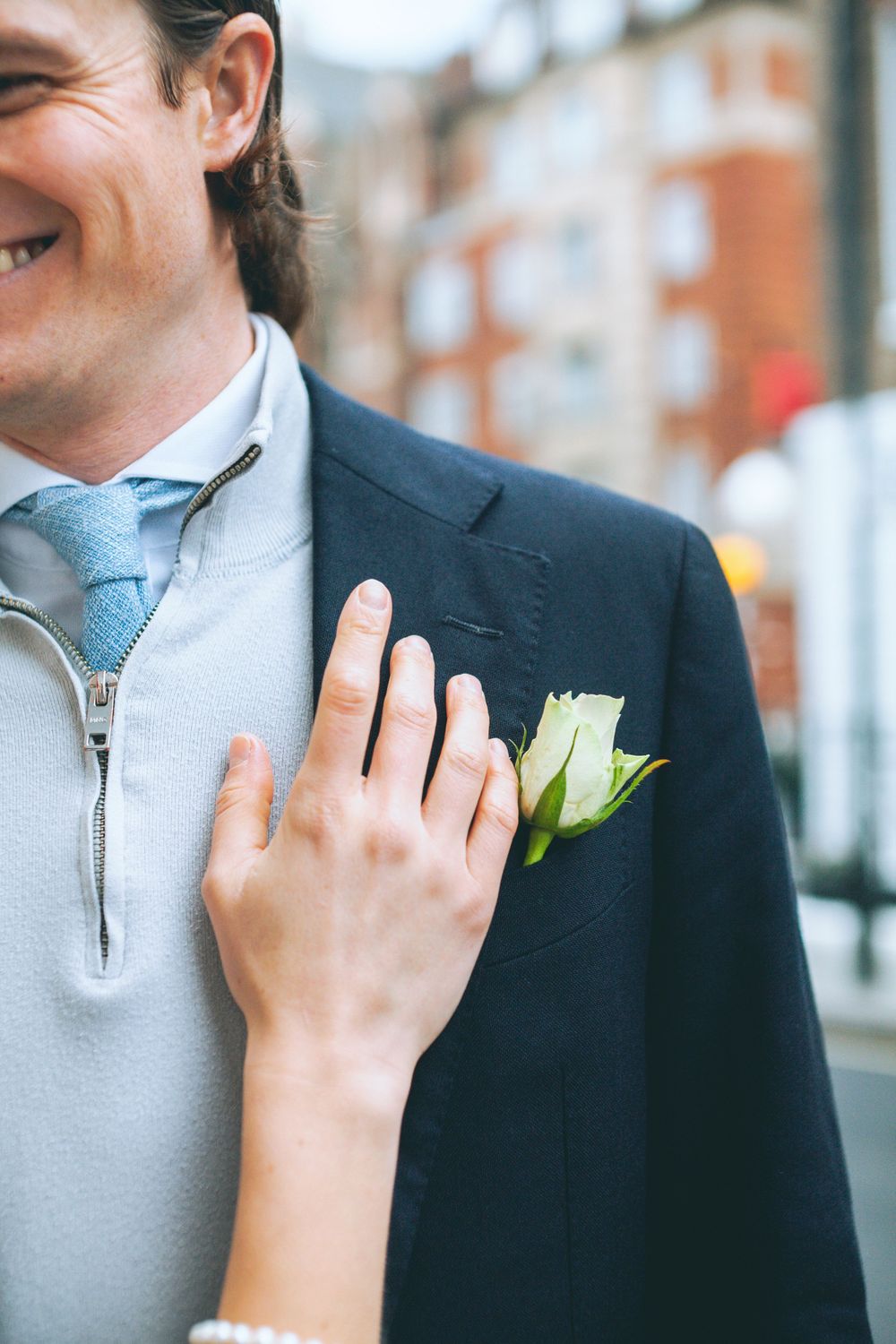 London engagement session detail featuring a couple’s hands and elegant wedding styling in an urban setting.