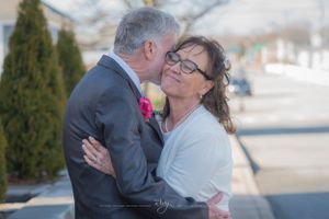 Older couple kiss after being married