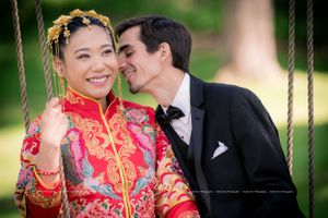 Close up shot of groom kissing his beautiful bride on neck as they sit on swing