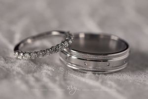Macro shot of wedding rings on beautiful white counter
