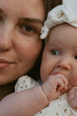A series of close-up images showing tender moments between a parent and baby gently kissing.