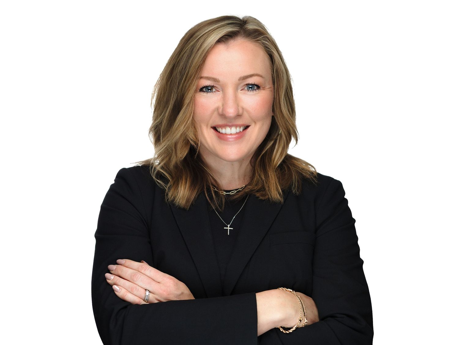 Professional headshot photos of someone in business attire against a dark background.