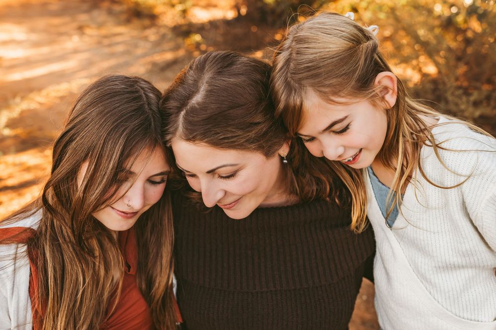 Close-up shots of tender family moments captured in warm sunset lighting.