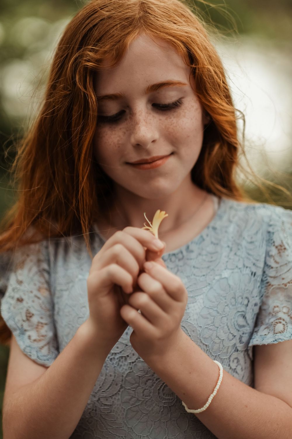 girl with red hair holding flower Lafayette family photo session
