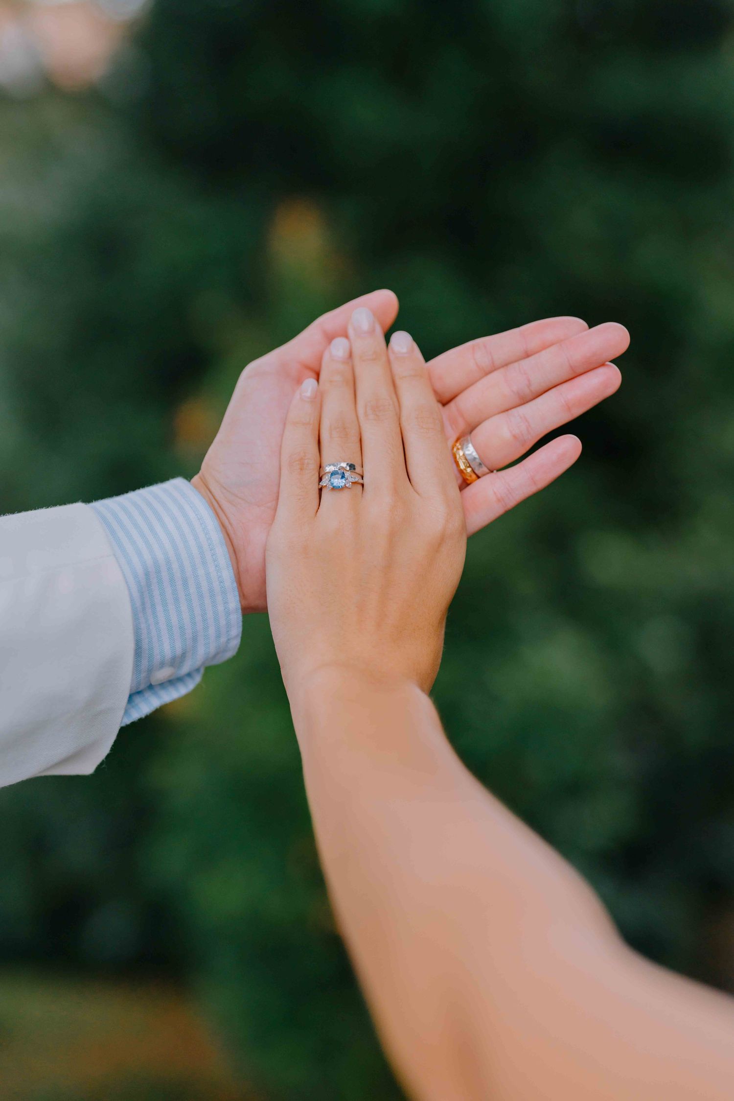 newlywed hands with wedding and engagement rings