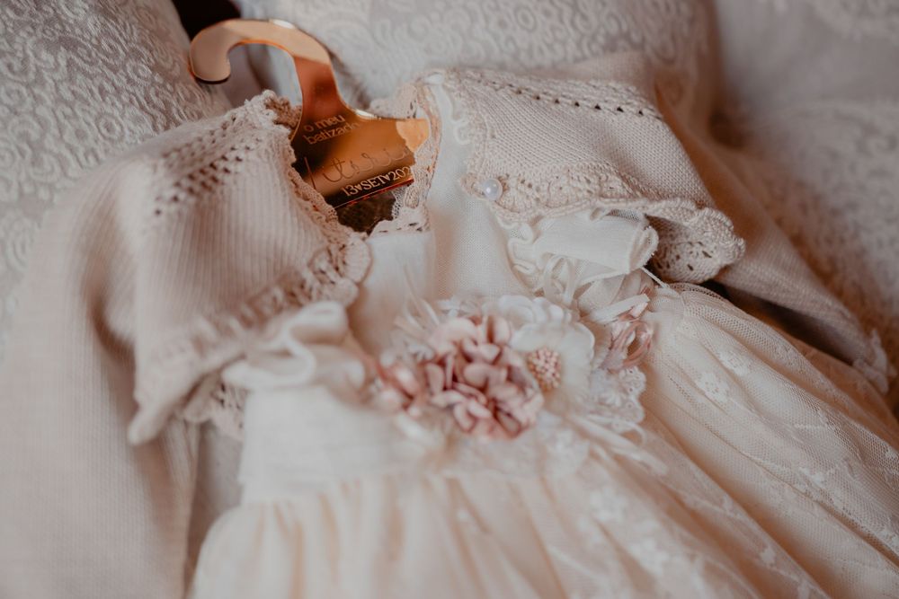 Delicate lace details and soft pink fabric create an elegant feminine aesthetic in this close-up textile shot.