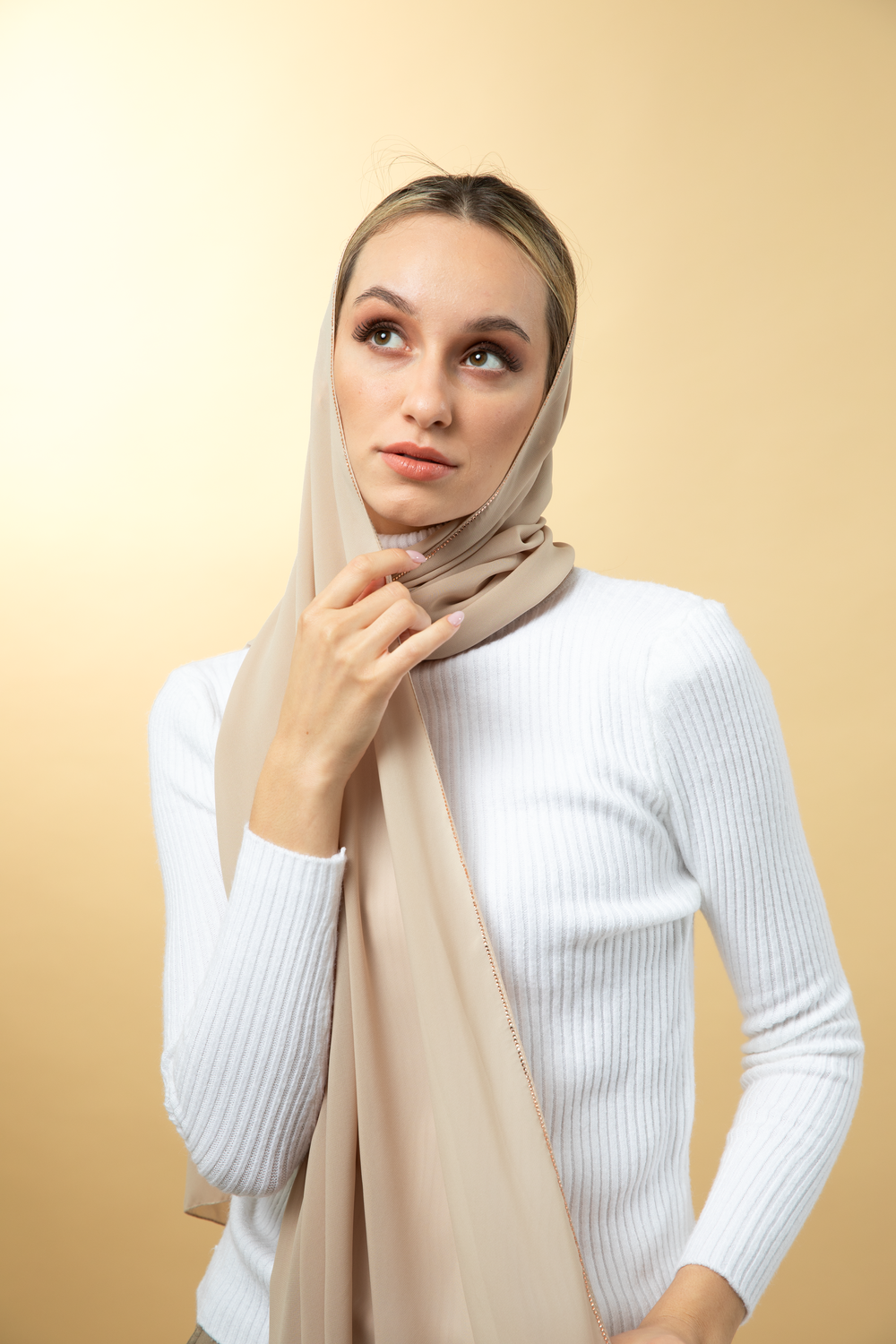 Portraitae indoor scarf photoshoot featuring elegant models in Dubai studio
