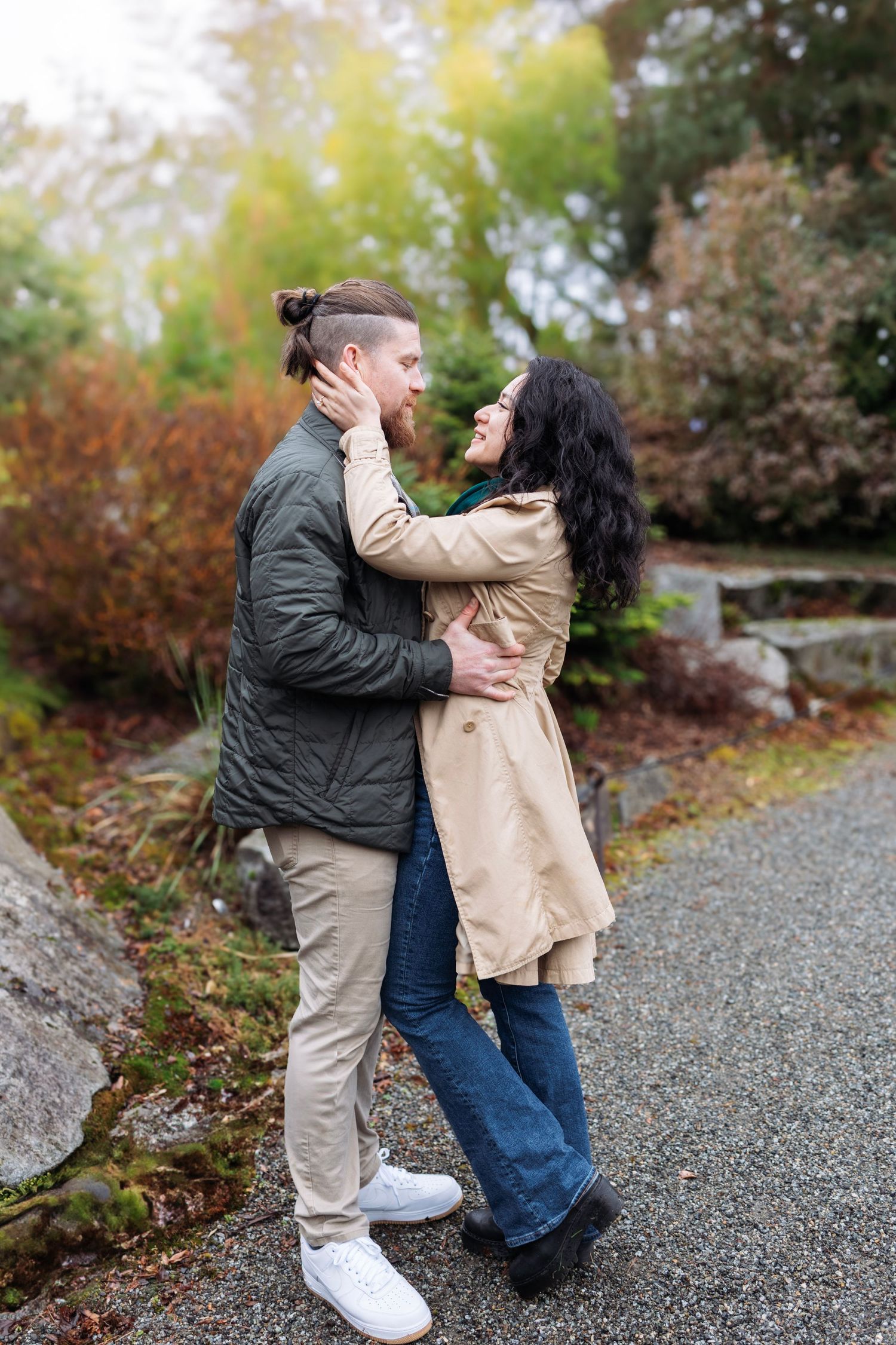 Sequence of intimate couple portraits on gravel path surrounded by fall colors.