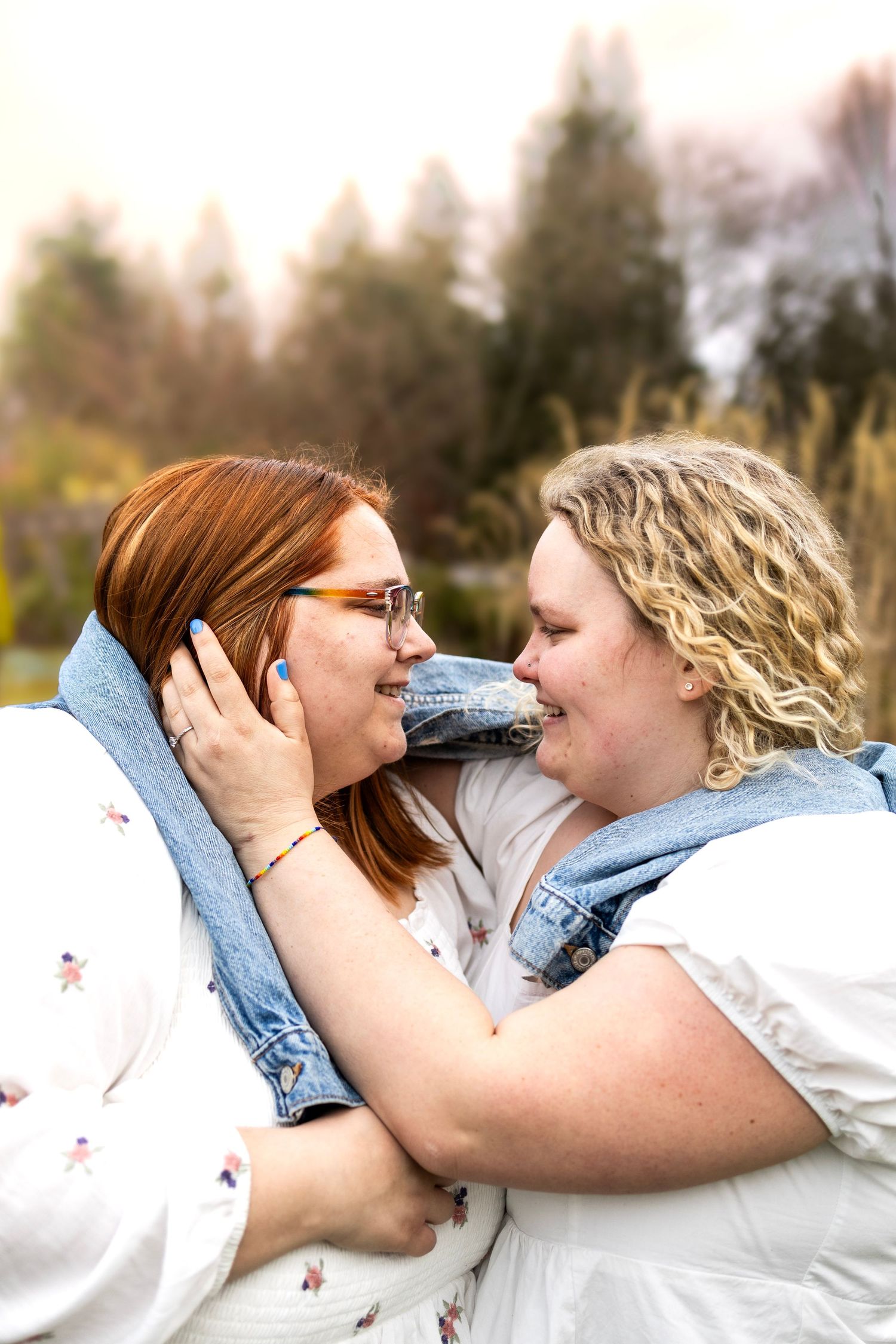 Close-up shots of two people embracing outdoors with denim and white clothing.