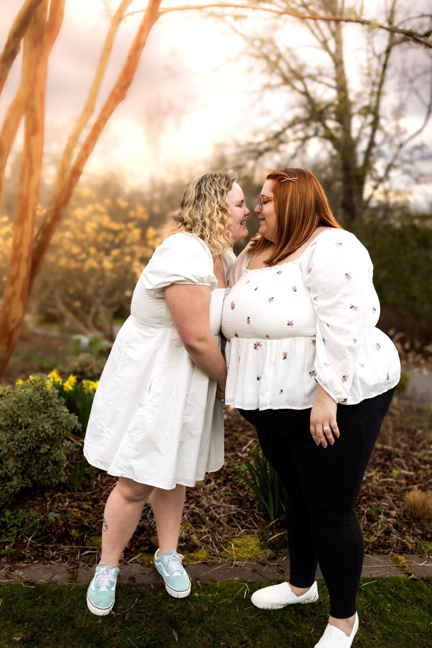 Playful sequence of two people in white and black outfits against a sunset garden setting.