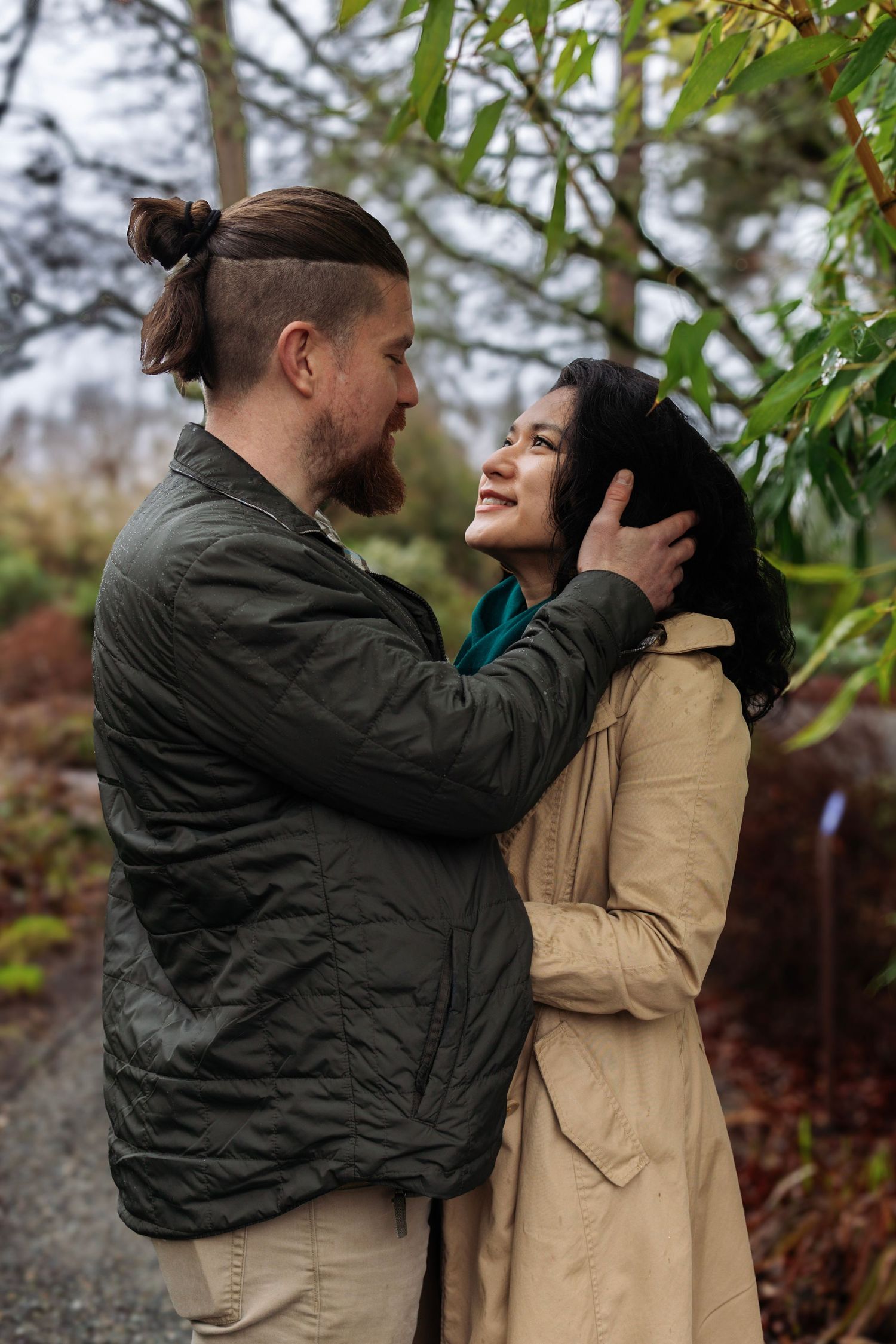Romantic outdoor couple photos showing tender moments among autumn foliage.