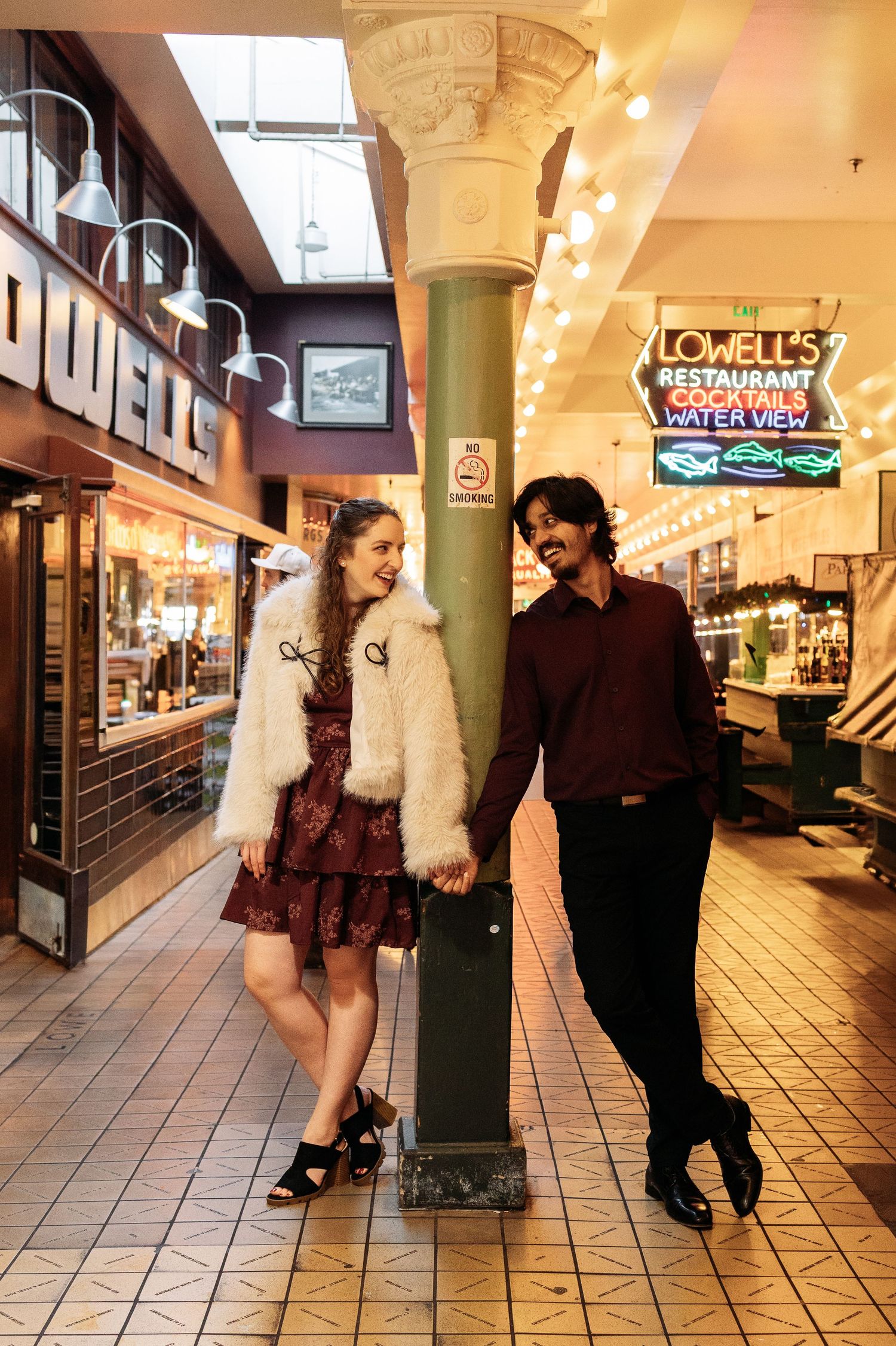 Four sequential photos show a couple dancing together in a brightly lit indoor shopping arcade or mall hallway.