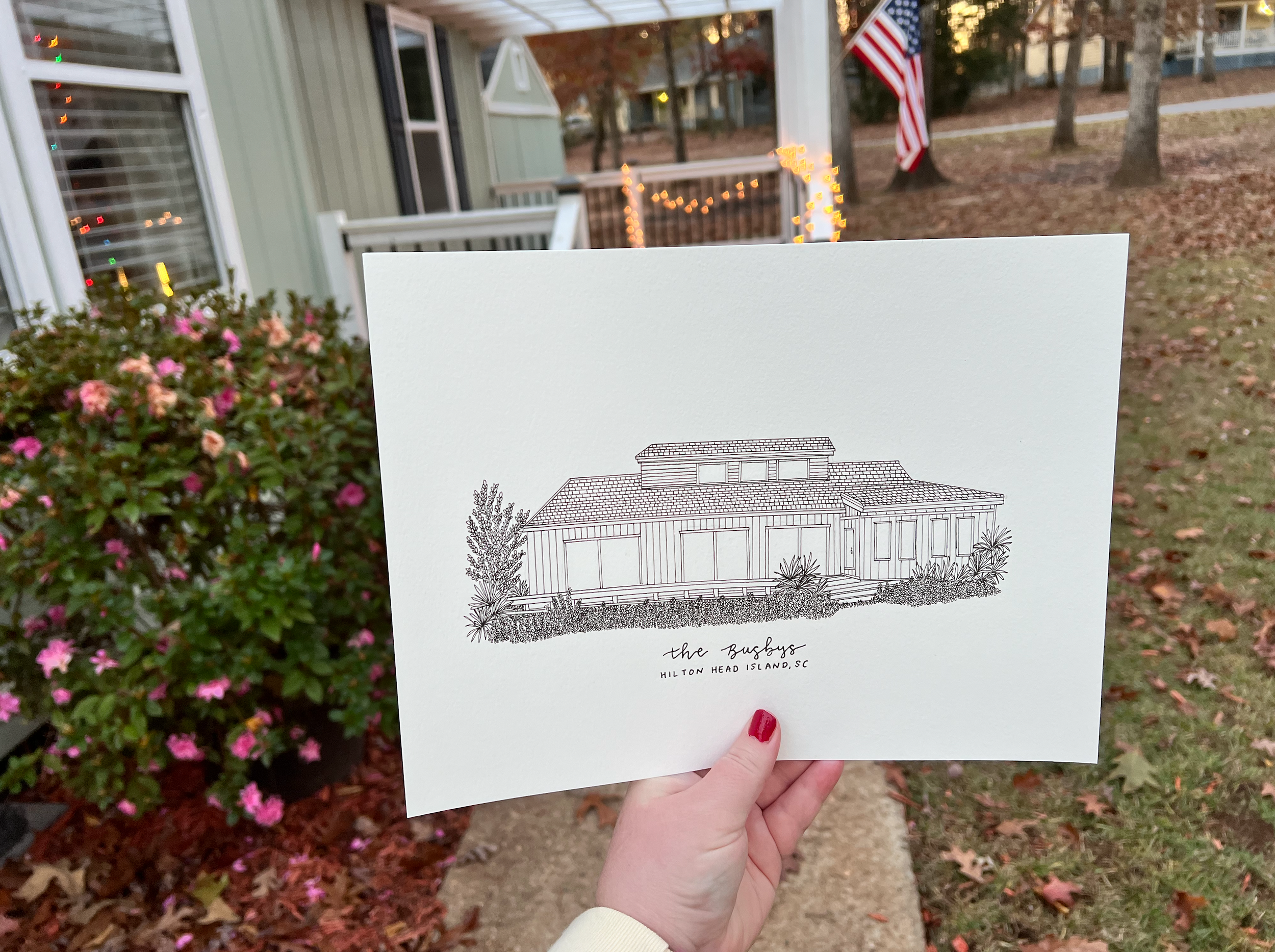 Simple line drawing of a ranch-style house with landscaping held against a garden background.