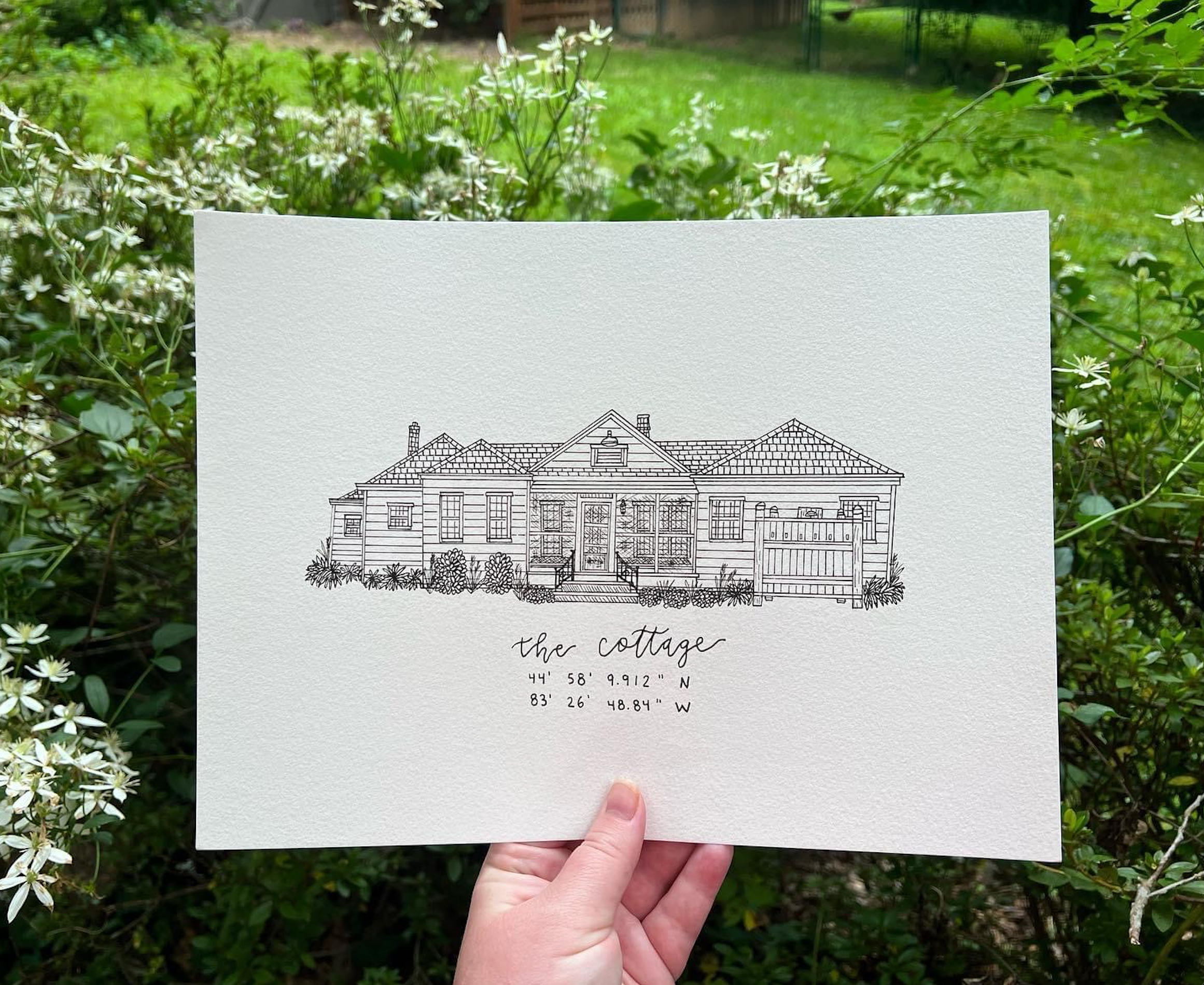 Delicate architectural drawing of a grand cottage-style residence with detailed facade elements.