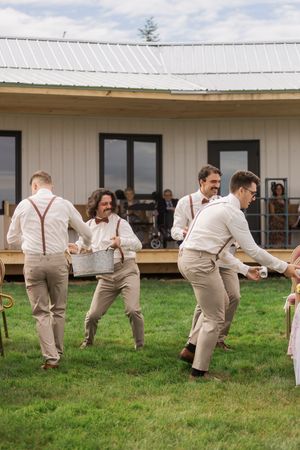 beer boys hand out beer during genuine wedding ceremony, relaxed calm wedding day photography in Moncton New Brunswick