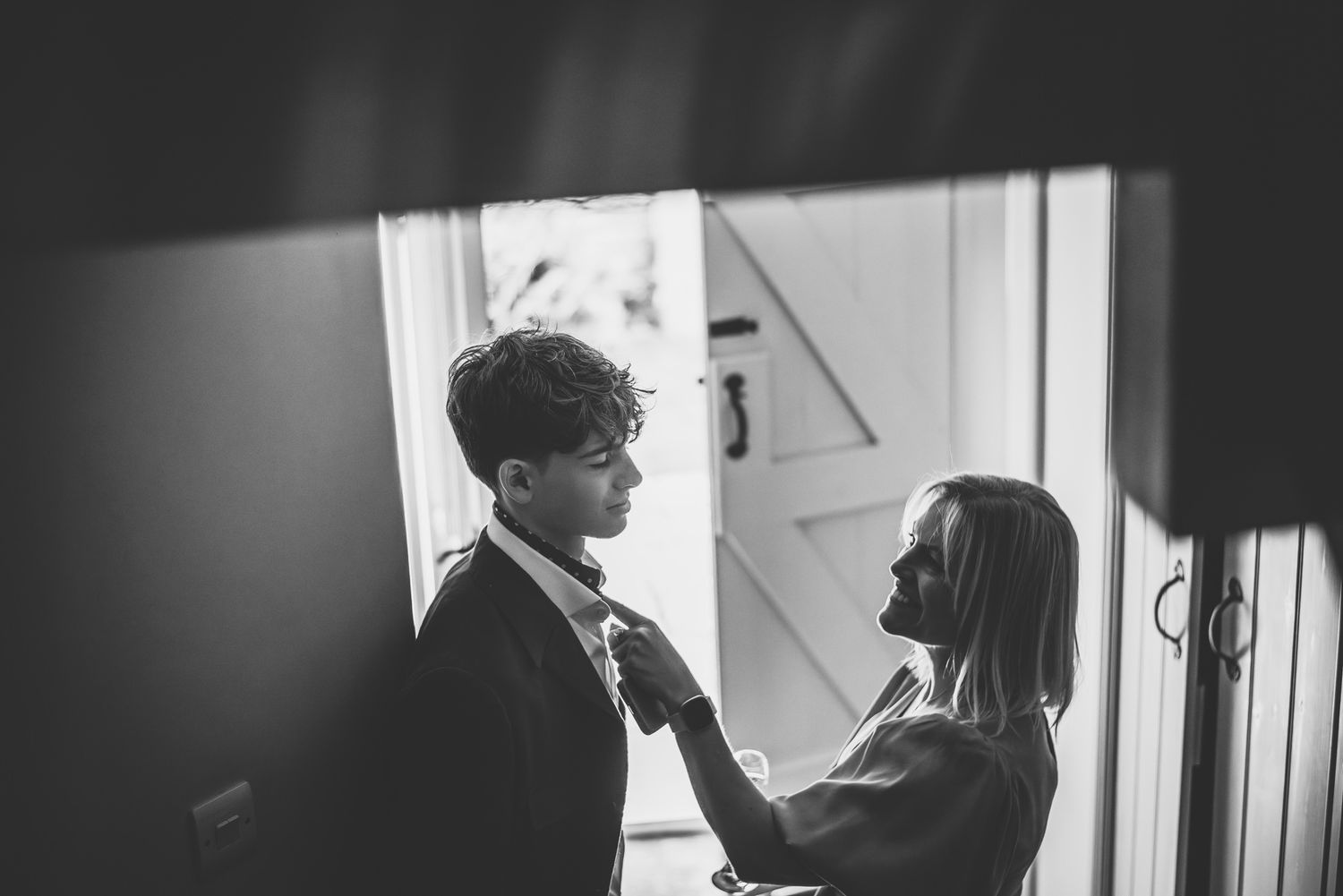 Black and white photo series showing a person in silhouette by a window creating a moody atmospheric effect.