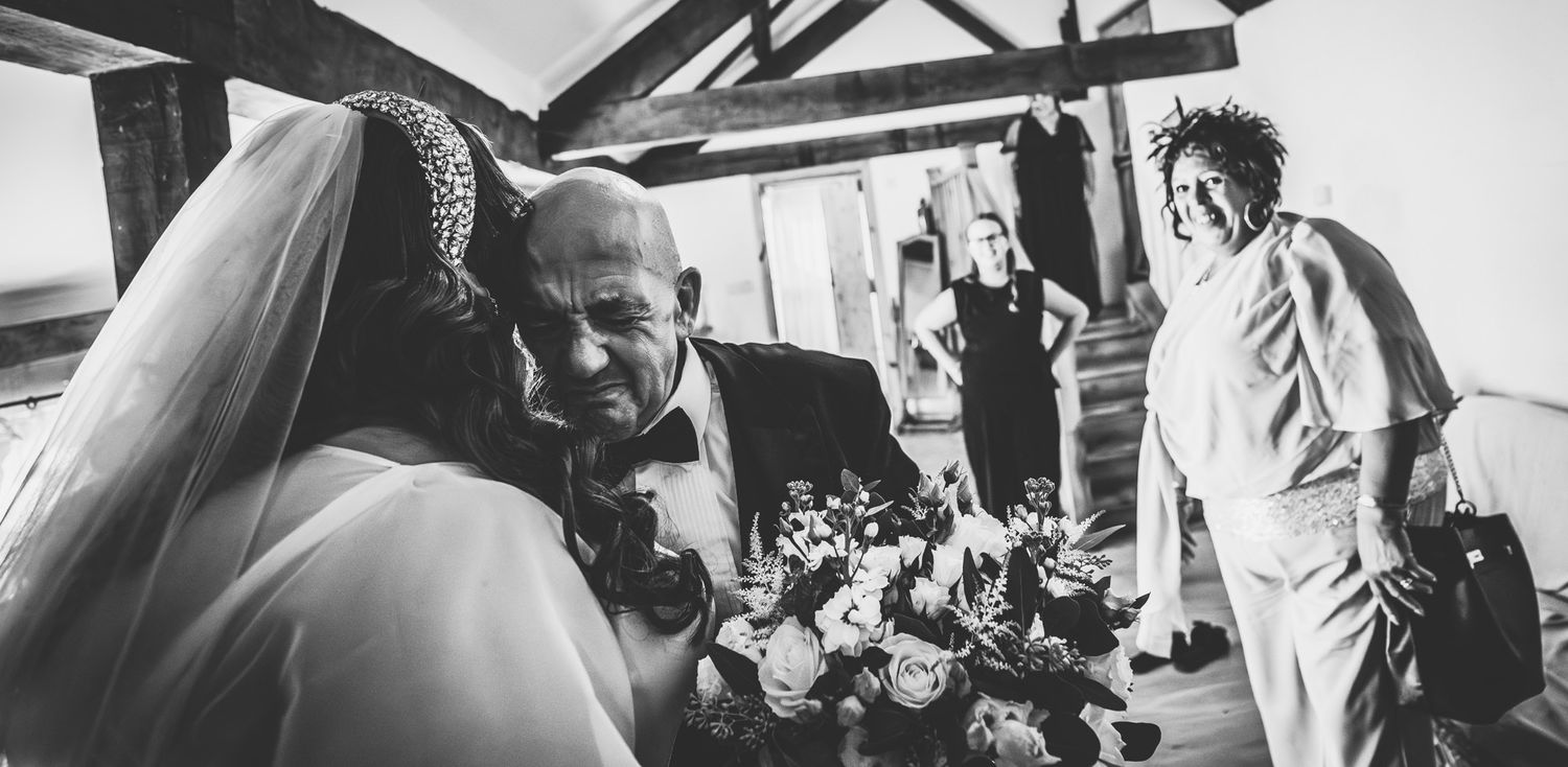 A black and white photo collage showing multiple candid moments from what appears to be a wedding celebration.
