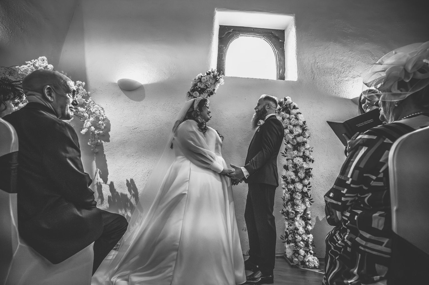 A black and white photo collage shows a wedding celebration with dancing, flowers, and formal attire.
